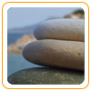 This is an image being used for Birth Bliss.  It is a picture of three stacked rocks on a cliff.